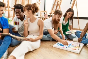 group-people-smiling-happy-drawing-sitting-floor-art-studio